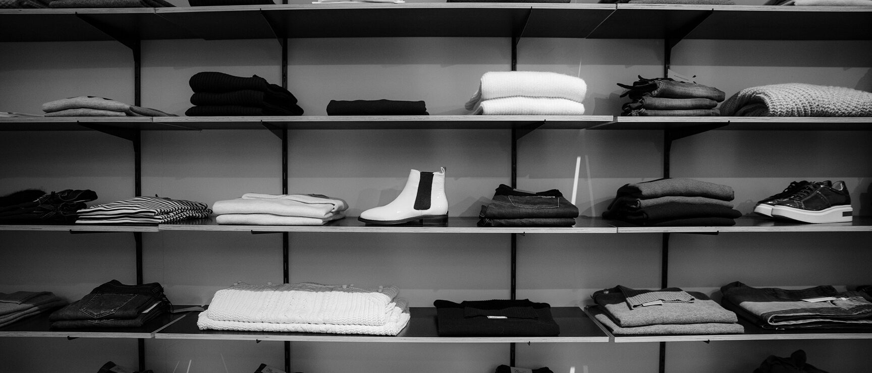 Folder clothing on shelves